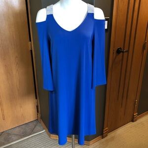 Tradition dress with rhinestone accents.  Size 10